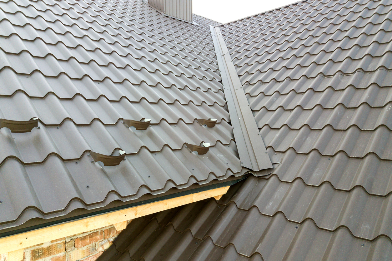 The intersection between two sections of roof where a metal roof valley is situated